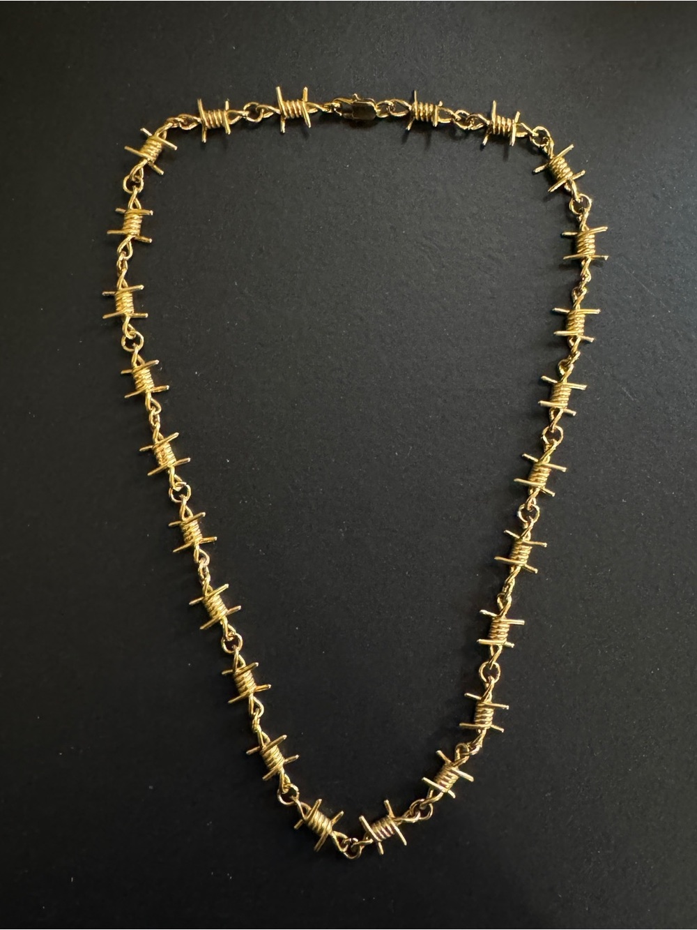 Gold barbed wire choker necklace